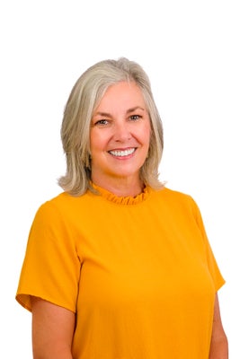 Portrait of Kristina Cusick, REALTOR®, CRS, Broker/Owner